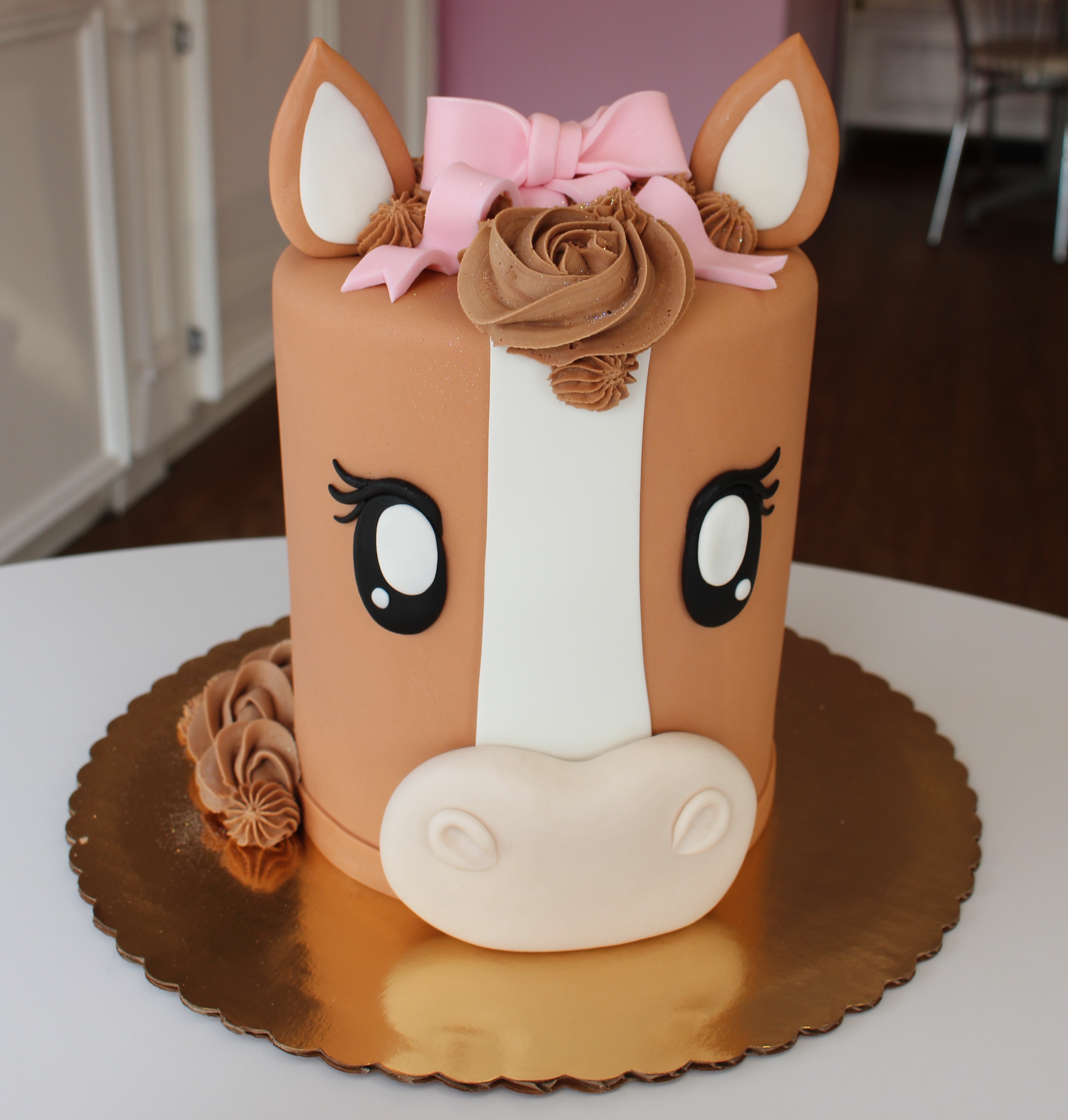 Brown and White Horse Head Cake with Pink Fondant Bow