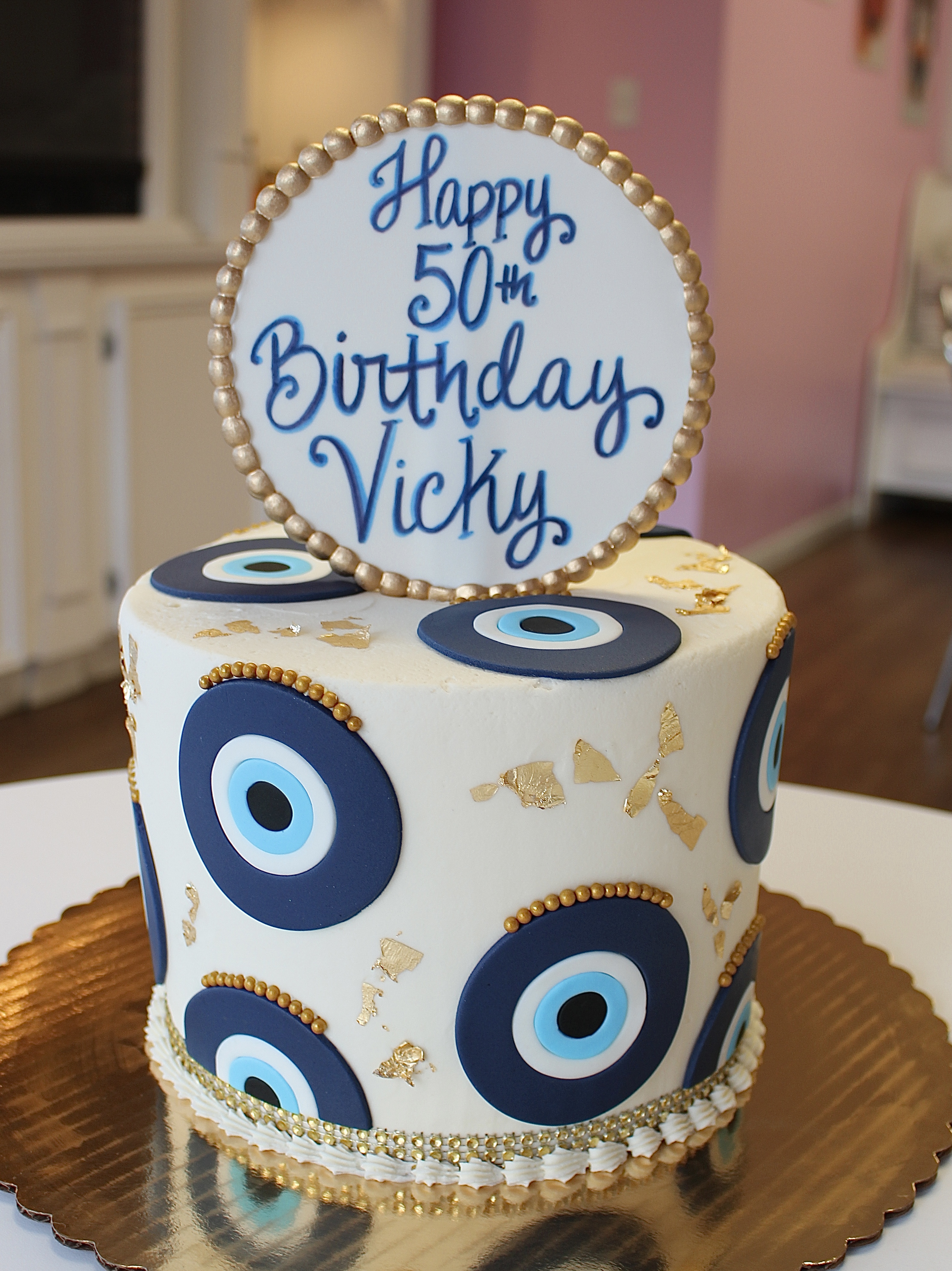 Evil Eye Birthday Cake with Elegant Gold Leaf Flakes and Bling Border