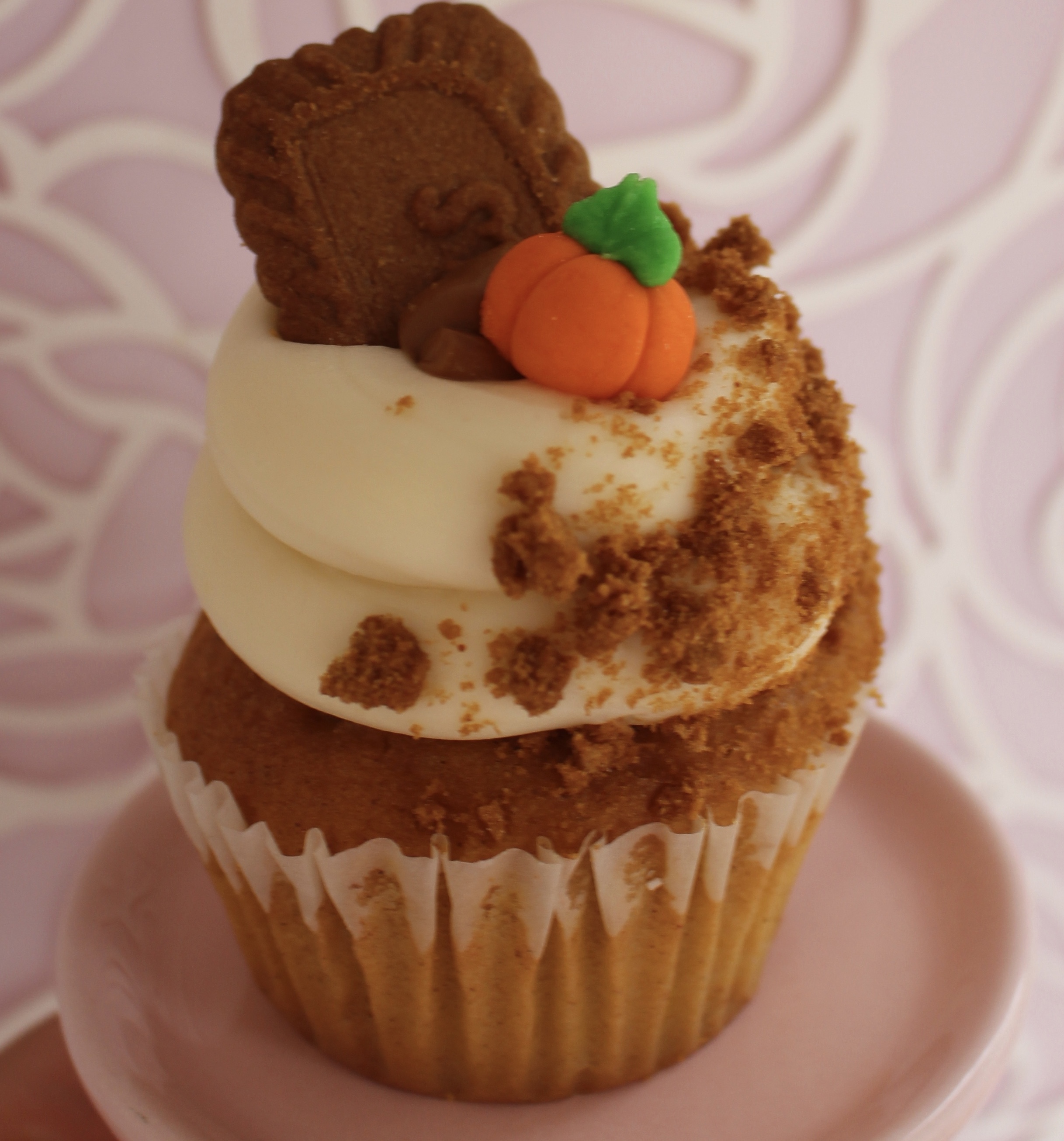 A pumpkin cake filled with cookie butter, topped with cream cheese, biscoff cookie and crumbs, and more cookie butter!